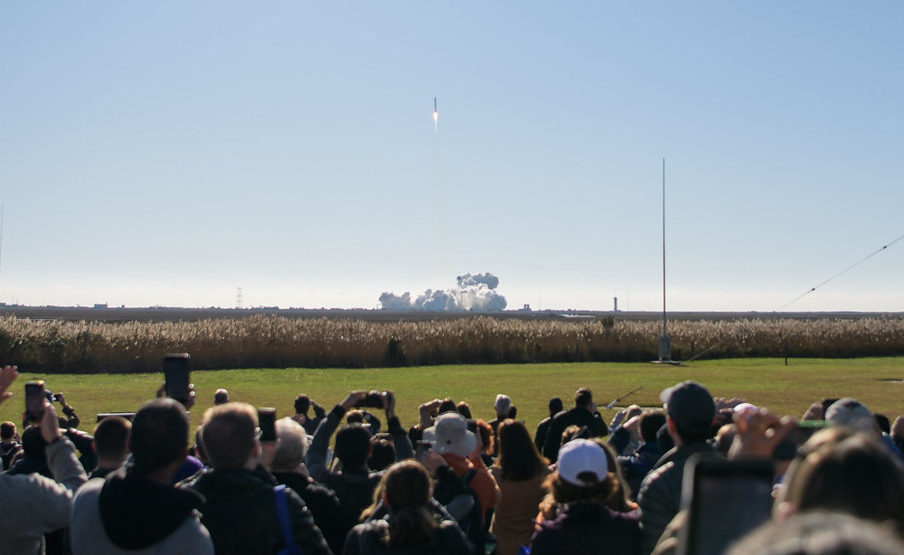  A crowd watches from a safe distance as Northrop Grumman launches its 12th cargo resupply mission to the International Space Station from Pad-0A of NASA's Wallops Flight Facility in Virginia Nov. 2, 2019. Credits: NASA/Bill Ingalls 