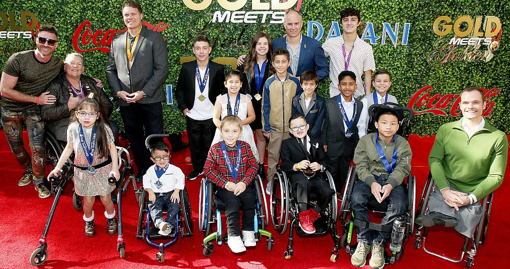  The children and para-athletes of Angel City Sports, the official beneficiary of Gold Meets Golden, presented by Coca-Cola, BMW Beverly Hills and FASHWIRE.